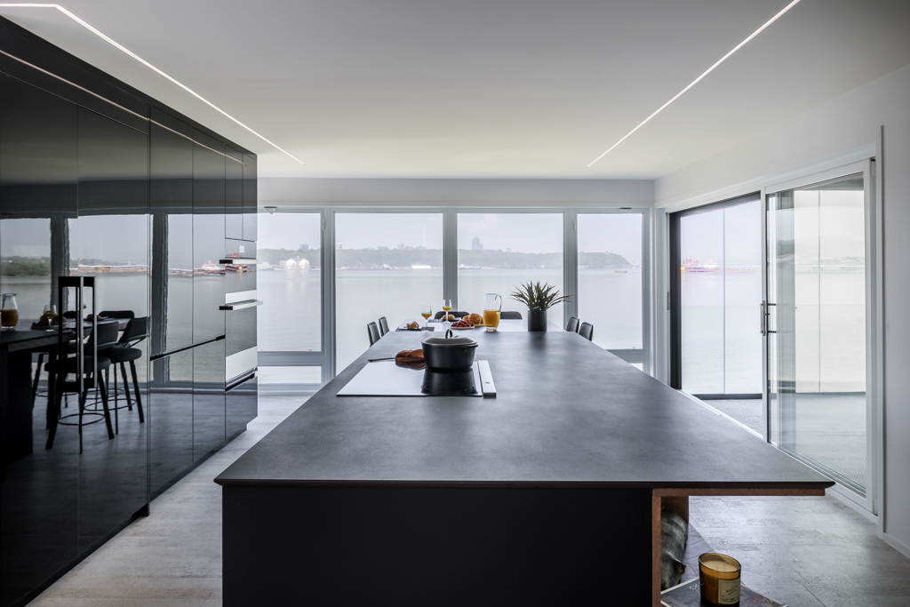 Image of a kitchen with a concrete countertop.