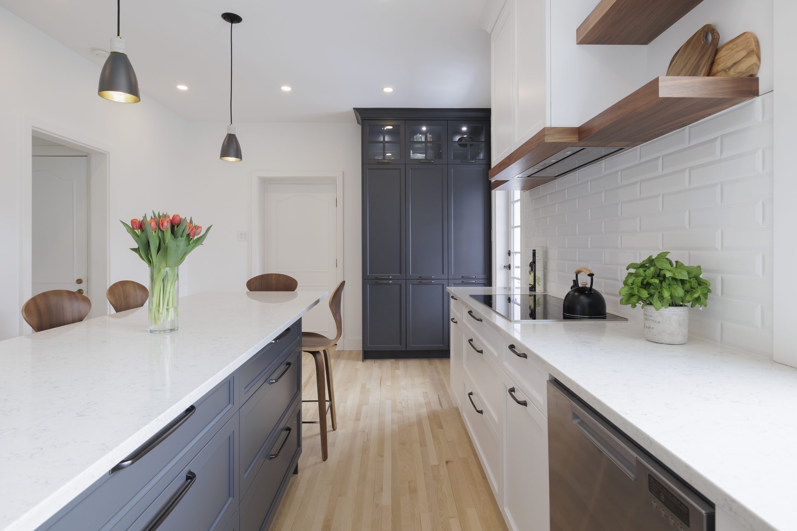 A kitchen created with a mix of gray and blue colors.