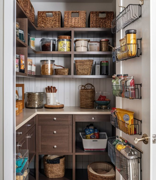 walk-in pantry filled with food and multiple racks installed on the door