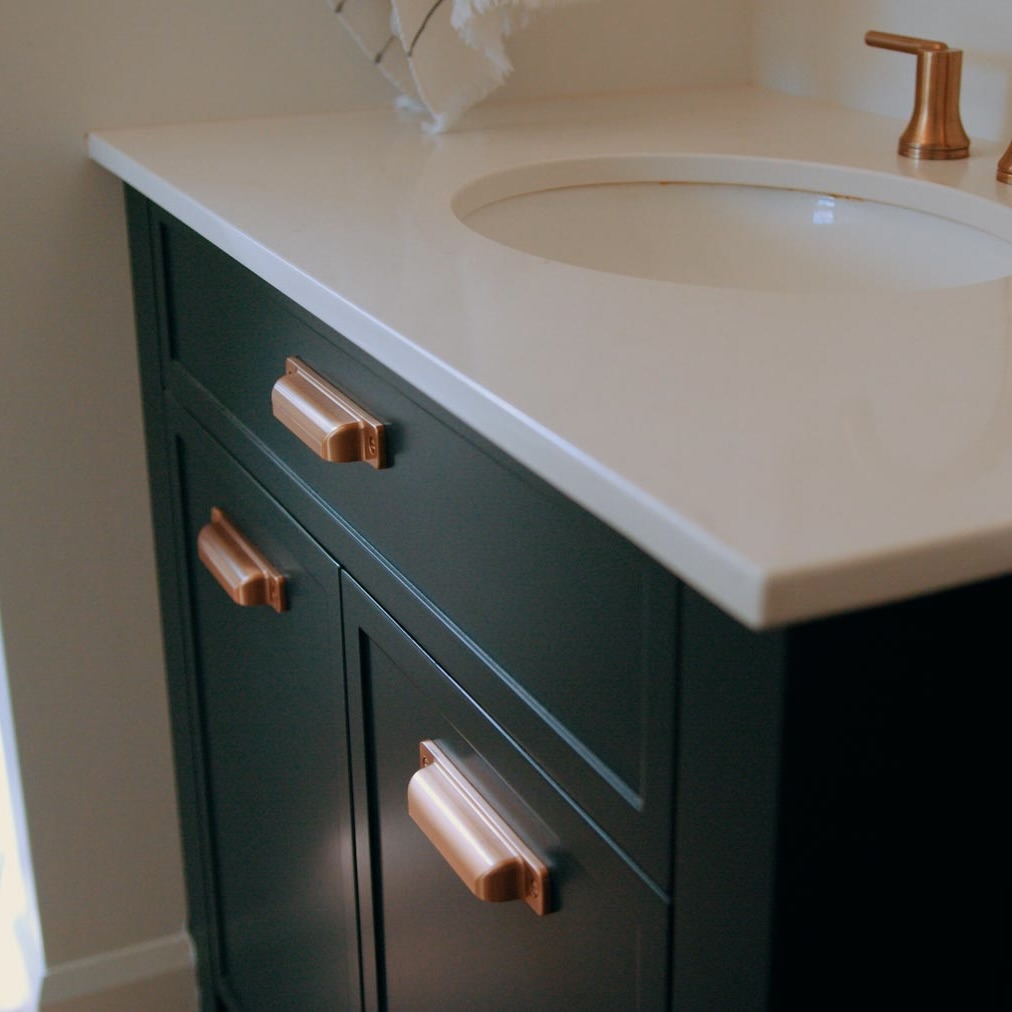 Bathroom sink with custom vanity and light countertop