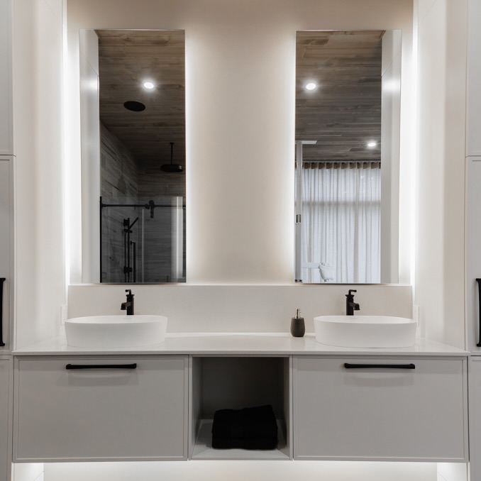 Modern bathroom with integrated mirror cabinet and double sink