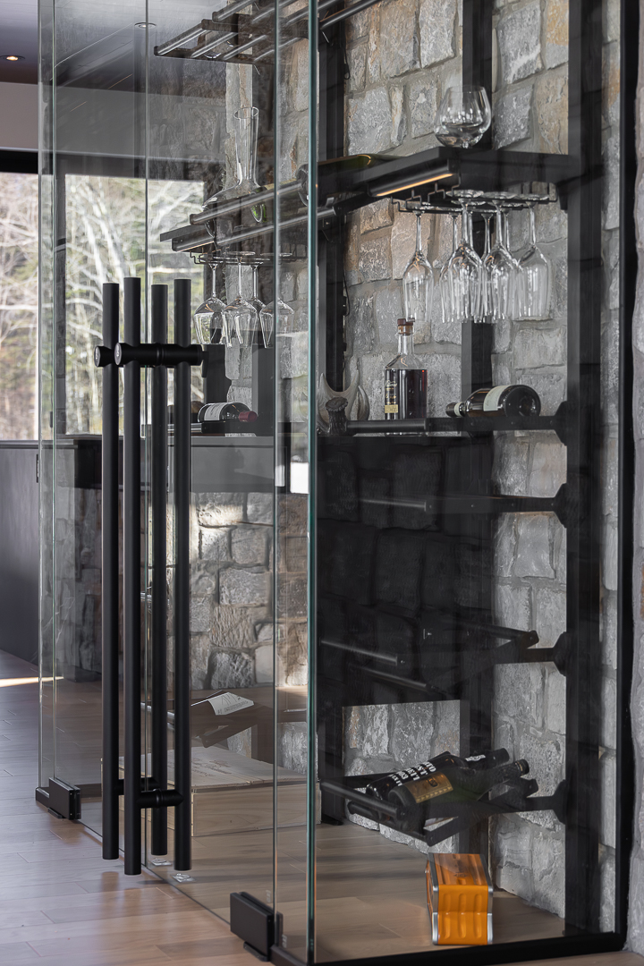 Glass-front cabinets and custom storage for a renovated kitchen.